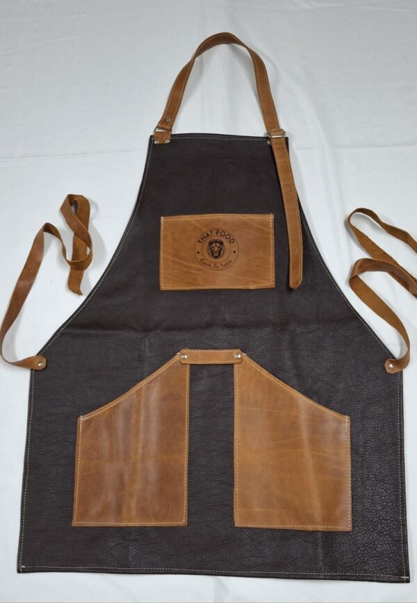 Buffed brown coloured leather apron. Standard size. Product of that food.